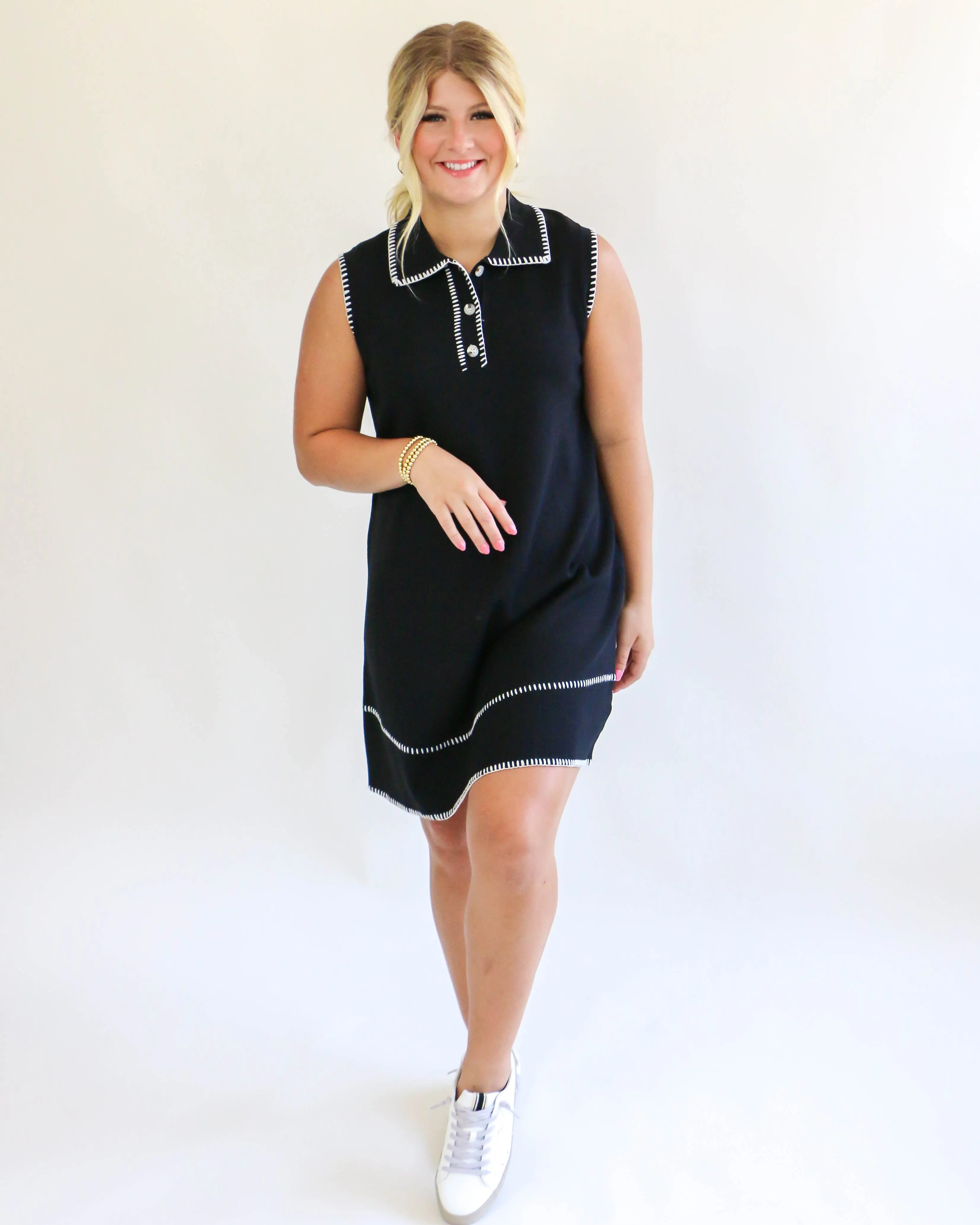 Collared sleeveless black dress with cream trim